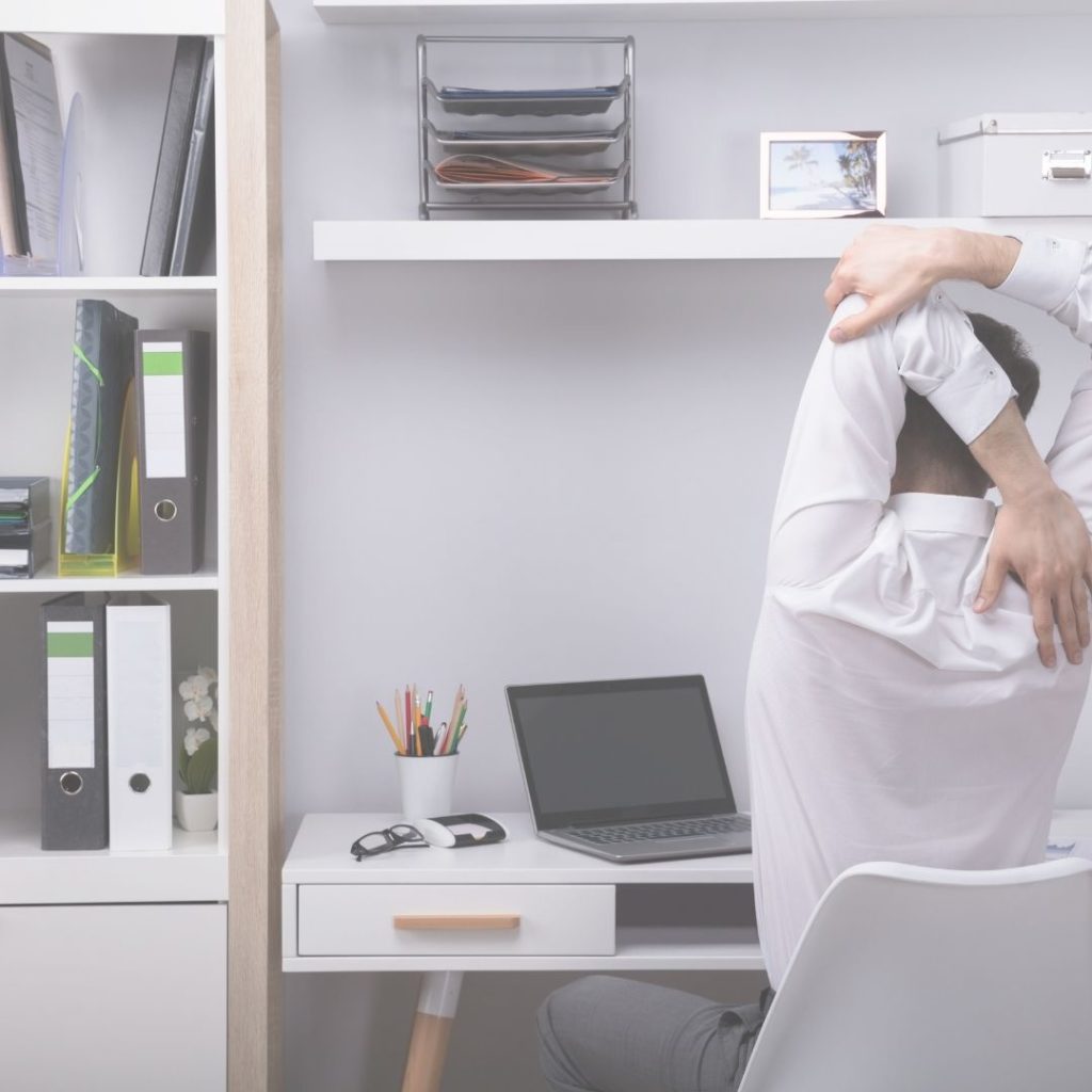 image of desk worker stretching